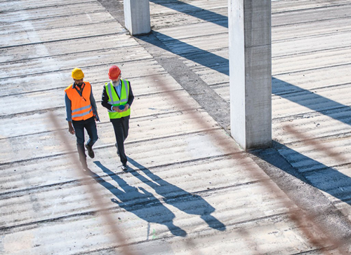 Bouwvakkers op bouwterrein